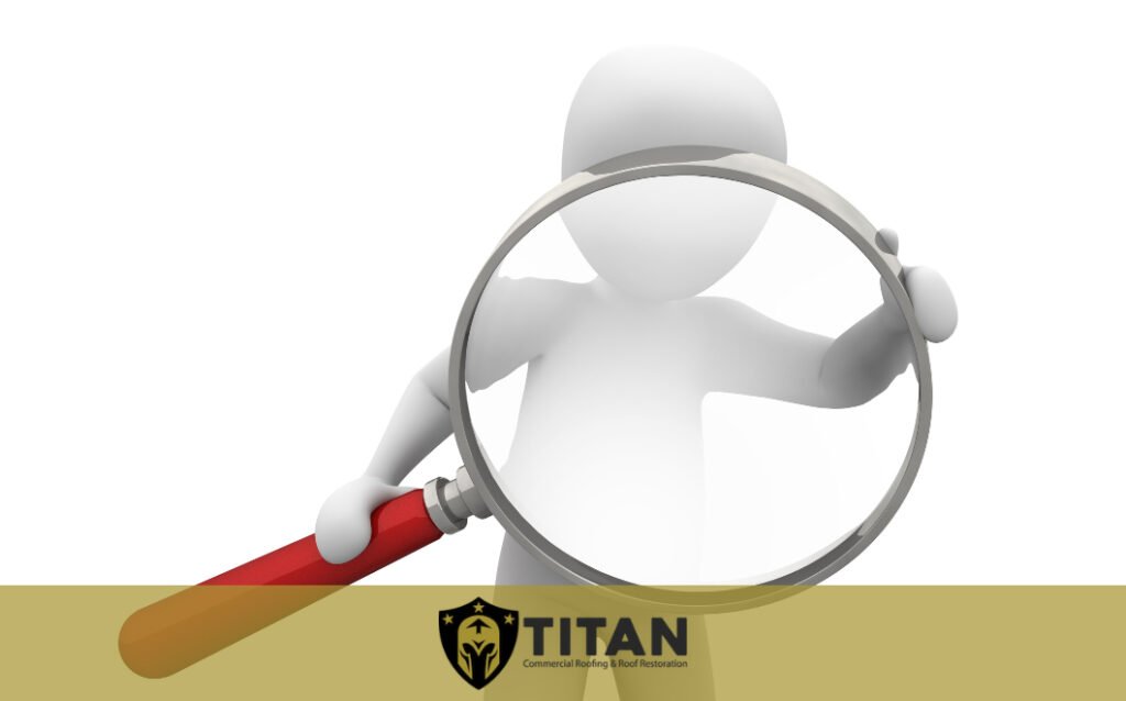 3D figure holding a magnifying glass with a red handle, magnifying its own face; Titan Commercial Roofing and Restoration logo at the bottom.